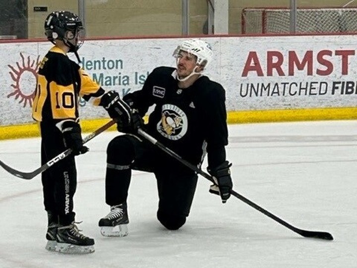  Windsor’s Logan Ferriss, 13, recently signed a one-day contract and skated with the Pittsburgh Penguins through Make-A-Wish Foundation. In this photo he is pictured on the ice with Sydney Crosby. Jackie Ferriss photo courtesy of Make-A-Wish Foundation.