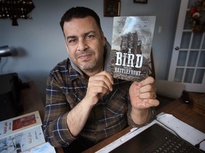Mohamed Burhan, a writer, journalist, and Syrian refugee who is now living in Windsor and soon to gain his Canadian citizenship is shown at his home on Tuesday, March 14, 2023. He released a book of poetry this month based on his experiences related to the ongoing Syrian civil war.