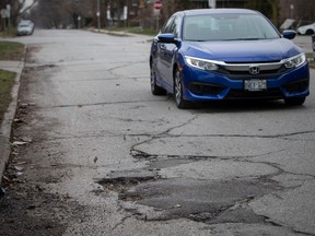 City council will look at adding a new tax levy to fund more local road repairs. Shown here, a car drives north along the 3100 block of Peter Street on Wednesday, March 29, 2023.