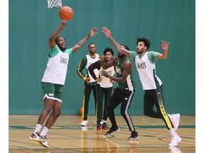 Members of the St. Clair College men's basketball team are shown during a team practice.