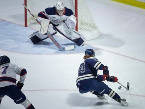 Windsor Spitfires' forward Oliver Peer cuts to the net for a scoring opportunity against Saginaw goalie, Tristan Lennox, during Thursday's game at the WFCU Centre.