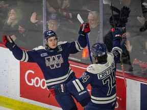 OHL scoring champion Matthew Maggio, left, of the Windsor Spitfires celebrates one of his league-leading goals with  rookie defenceman Anthony Cristoforo.