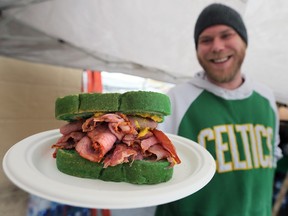 Ryan Hayes was serving up St. Patrick's Day corn beef sandwiches on special green bread at the O'Maggio's Kildare House in Windsor on Friday, March 17, 2023.