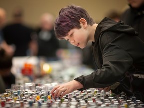 Hunter Godfroy, 10, inspects the Hot Wheels on display at the Windsor/Essex Toy Show at the Tecumseh Legion, on Sunday, March 5, 2023.