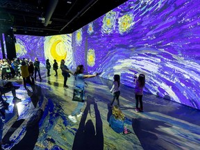 Attendees of the Imagine Van Gogh exhibition in London, Ontario, in October 2022.