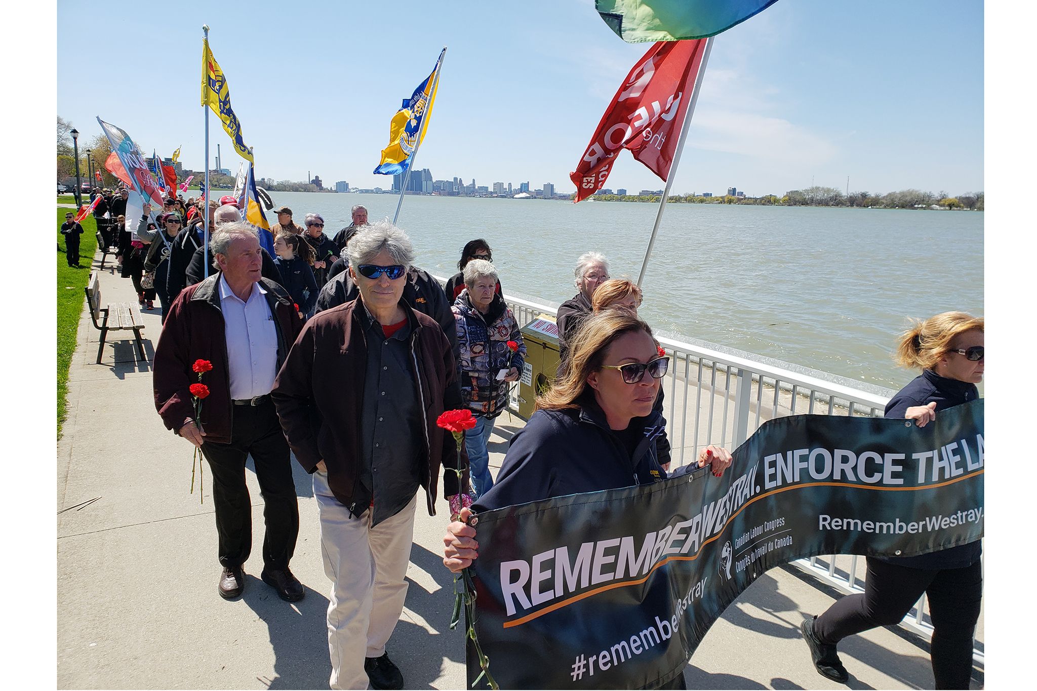 Marchers gather at Windsor’s riverfront for Day of Mourning.  Supplied