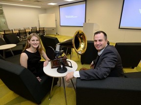 David Ciccarelli, CEO of Voices.com and his wife Stephanie Ciccarelli, with a gramophone from the early 1900's and a current day microphone in a meeting room at the new Voices.com office on Wednesday January 18, 2017. (Free Press file photo)
