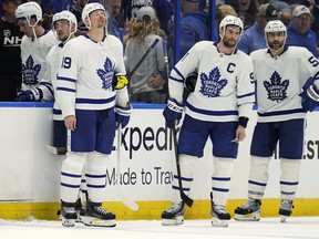 Maple Leafs (from left) Jason Spezza, John Tavares and Mark Giordano look on dejectedly last spring at Amalie Arena after Brayden Point's overtime goal forced a seventh game back in Toronto.