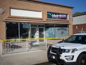 Police tape at a building at 1657-1659 Drouillard Road in Windsor on the morning of April 14, 2023.