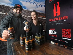 Jeff Denomme (left) and wife Christie of Windsor hot sauce company Halo Heats promote Windsor's first Heatseeker Hot Sauce Festival. Photographed April 21, 2023.