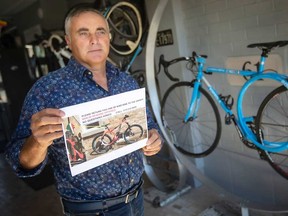 South Windsor resident Lou Tortola shows a reward poster he made for his stolen red 29er Carbonio RoundTail - a unique mountain bike of his own design. Photographed April 12, 2023.