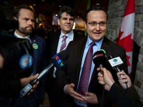 Windsor-Tecumseh MP Irek Kusmierczyk, right, is joined by Ontario Minister of Environment, Conservation and Parks David Piccini and Windsor-Tecumseh MPP Andrew Dowie, centre, in announcing new milestones towards creation of Ojibway National Urban Park during a news conference in Windsor on Monday, April 17, 2023.