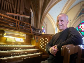 Jim Fast, guest organist at Assumption Church, is pictured with the organist on Friday, April 21, 2023.