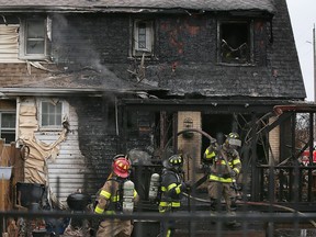 Windsor firefighters work at a house fire on Saturday, April 1, 2023, in the 900 block of Parent Avenue.