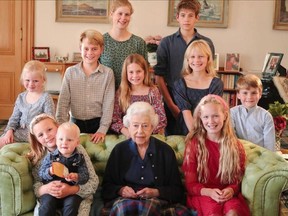 Queen Elizabeth poses with some of her grandchildren and great grandchildren in a photo taken weeks before her death last year and shared by Prince William and Princess Catherine on social media Friday, April 21, 2023.