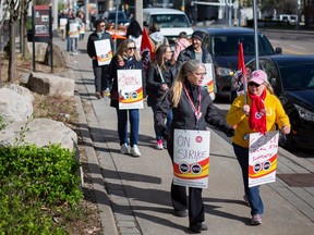 Members of the Public Service Alliance of Canada picket outside the 400 Building at City Hall Square East, on day one of a nationwide general strike, on Wednesday, April 19, 2023.