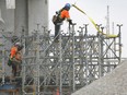 Workers are shown at the Gordie Howe International Bridge construction site in Windsor on March 29, 2023.