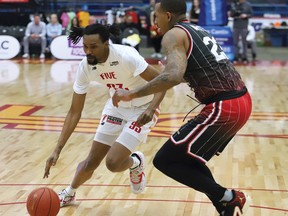 Billy White, left, became the NBL of Canada's all-time leading playoff scorer on Sunday in helping the Windsor Express reach the league final for the first time since 2015. John Lappa/Sudbury Star/Postmedia Network