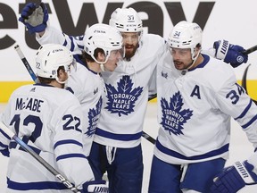 Toronto Maple Leafs teammates congratulate Mitch Marner (#16) of the on scoring a goal in the third period against the Florida Panthers in Game 4.