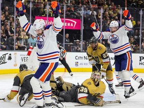 Leon Draisaitl #29 and Zach Hyman #18 of the Edmonton Oilers react after Hyman assisted Draisaitl on a first-period power-play goal against Laurent Brossoit #39 of the Vegas Golden Knights in Game Two of the Second Round of the 2023 Stanley Cup Playoffs at T-Mobile Arena on May 06, 2023 in Las Vegas, Nevada. The Oilers defeated the Golden Knights 5-1.
