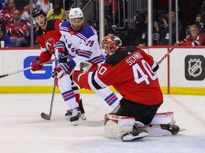 Devils goaltender Akira Schmid makes a save against the Rangers during first period action in game seven of the first round of the 2023 Stanley Cup Playoffs at Prudential Center in Newark, N.J., Monday, May 1, 2023.
