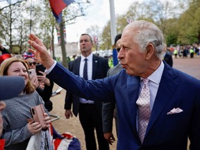 Britain's King Charles meets well-wishers during a walkabout on the Mall outside Buckingham Palace ahead of his coronation in London May 5, 2023.