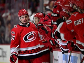 Hurricanes forward Seth Jarvis, left, celebrates with teammates after scoring a goal against the Devils during the first period in Game One of the Second Round of the 2023 Stanley Cup Playoffs at PNC Arena in Raleigh, N.C., Wednesday, May 3, 2023.