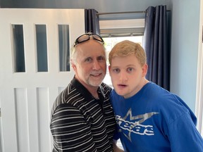 WINDSOR, SATURDAY, MAY 12, 2023 - Bruce Scott, left, named Matthew's Angel House after his son Matthew, right, with the hopes that one day it can house four developmentally handicapped young men. The father and son are shown at the opening of Matthew's Angel House on Saturday, May 13, 2023.