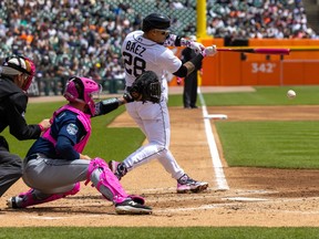 May 14, 2023; Detroit, Michigan, USA; Detroit Tigers shortstop Javier Baez (28) hits an infielders choice for an RBI in the first inning against the Seattle Mariners at Comerica Park.