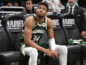 Milwaukee Bucks forward Giannis Antetokounmpo (34) sits on the bench after a 128-126 loss to the Miami Heat at Fiserv Forum in Milwaukee on April 26, 2023.