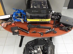 A Chatham man and woman face firearm charges after police and border officials seized firearm parts, a 3-D printer and ammunition a McFadden Avenue residence in Chatham. police say. (Supplied)