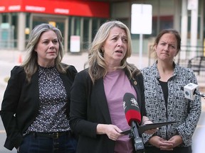 Ontario NDP leader Marit Stiles (centre) is flanked by Windsor West MPP Lisa Gretzky (left) and Essex Mayor Sherry Bondy (right) while speaking outside the emergency department of the Ouellette Campus of Windsor Regional Hospital on May 19, 2023.
