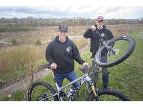 'Incredible response.' James Braakman, left, and Glyn Buck, both members of the Windsor-Essex Bike Community, are pictured at the location of the Libro Centre mountain bike trails in Amherstburg on Wednesday, May 3, 2023.