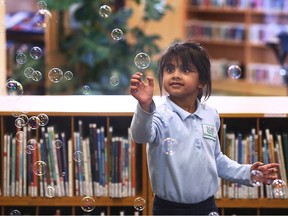 The Forest Glade branch of the Windsor Public Library celebrated its 35th anniversary on Monday, May 15, 2023. Alayna Hyder, 5, has some fun with a bubble machine during the event.