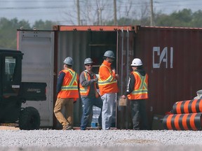 Workers are shown at the NextStar battery plant construction site in Windsor on Monday, the same day as news of work being suspended on part of the project.