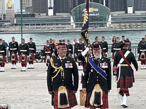 Prince Michael of Kent, right, marches after presenting new colours to the Essex and Kent Scottish Regiment Saturday, MAY 13, 2023.
