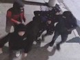 A surveillance camera image of five suspects in a group assault that occurred in downtown Windsor during the early hours of April 30, 2023.