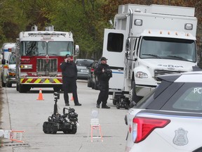 Windsor police officers are shown at the scene of a suspicious package at Tecumseh Road East and Ellrose Avenue on Tuesday, May 2, 2023.