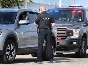 A Windsor Police officer speaks to a motorist after pulling them over in the 4400 block of Walker Road on Friday, May 12, 2023. A team of officers were in the area during a concentrated enforcement effort to reduce collisions at some of the most dangerous intersections in the city.