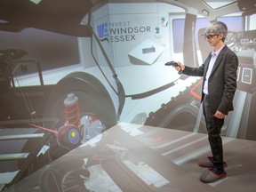 Sergio Barrera, CTO and founder of Virtualware, uses the Virtual Reality cave during a press announcement at the Automobility and Innovation Centre, on Thursday, April 27, 2023.