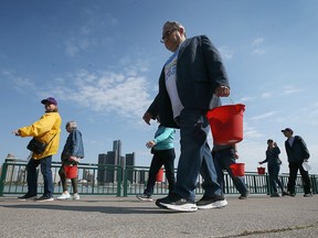 Rotarians from southwestern Ontario and Michigan participate in a "Walk for Water" event in downtown Windsor on Friday, May 5, 2023.