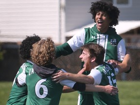 Players for the Lajeunesse Royals celebrate the team's WECSSAA boys' A soccer title.