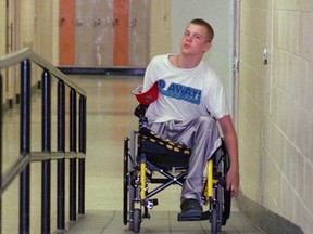 A wheelchair user utilizes a ramp on a Windsor school property in this 2001 file photo.