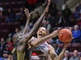 Windsor Express forward Billy White, right, drives to the basket against London Lightning centre Kur Jongkuch, left, during Thursday NBL of Canada game at the WFCU Centre.