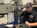 Seventeen-year-old Trevor Drury, shown at Cavalier Tool on Wednesday, June 14, 2023, started as a general machinist apprentice with the Windsor manufacturing company in February. He's a Grade 11 student in Herman Academy's OYAP program.