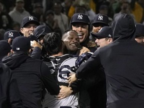 Domingo Germanof the New York Yankees celebrates his no-hit perfect game against the Oakland Athletics.