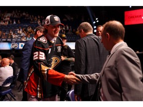 Windsor defenceman Konnor Smith, seen after being selected by the Anaheim Ducks at the 2023 NHL Draft, has been traded from the Peterborough Petes to the Owen Sound Attack in a multi-player deal.