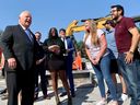 Ontario Premier Doug Ford (left) shares a laugh with some graduates of the Construction Craft Worker Level 1 training program of LiUNA!625 in Windsor. Windsor-Tecumseh MPP Andrew Dowie (centre) looks on.