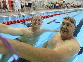 At right, Lou Pocock, who passed away last week, is seen in this 2013 photo with then Windsor Councillor Drew Dilkens, swimming during the opening of city's new aquatic centre.