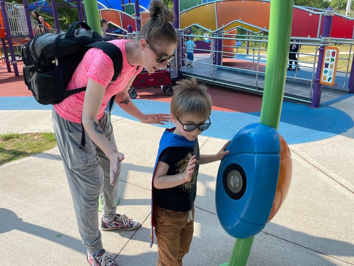  Taylor Balkwill and son Hank, 4, of Leamington try out the games available at the John McGivney Children’s Centre Saturday, June 17, 2023, during the Superhero Fun Day.